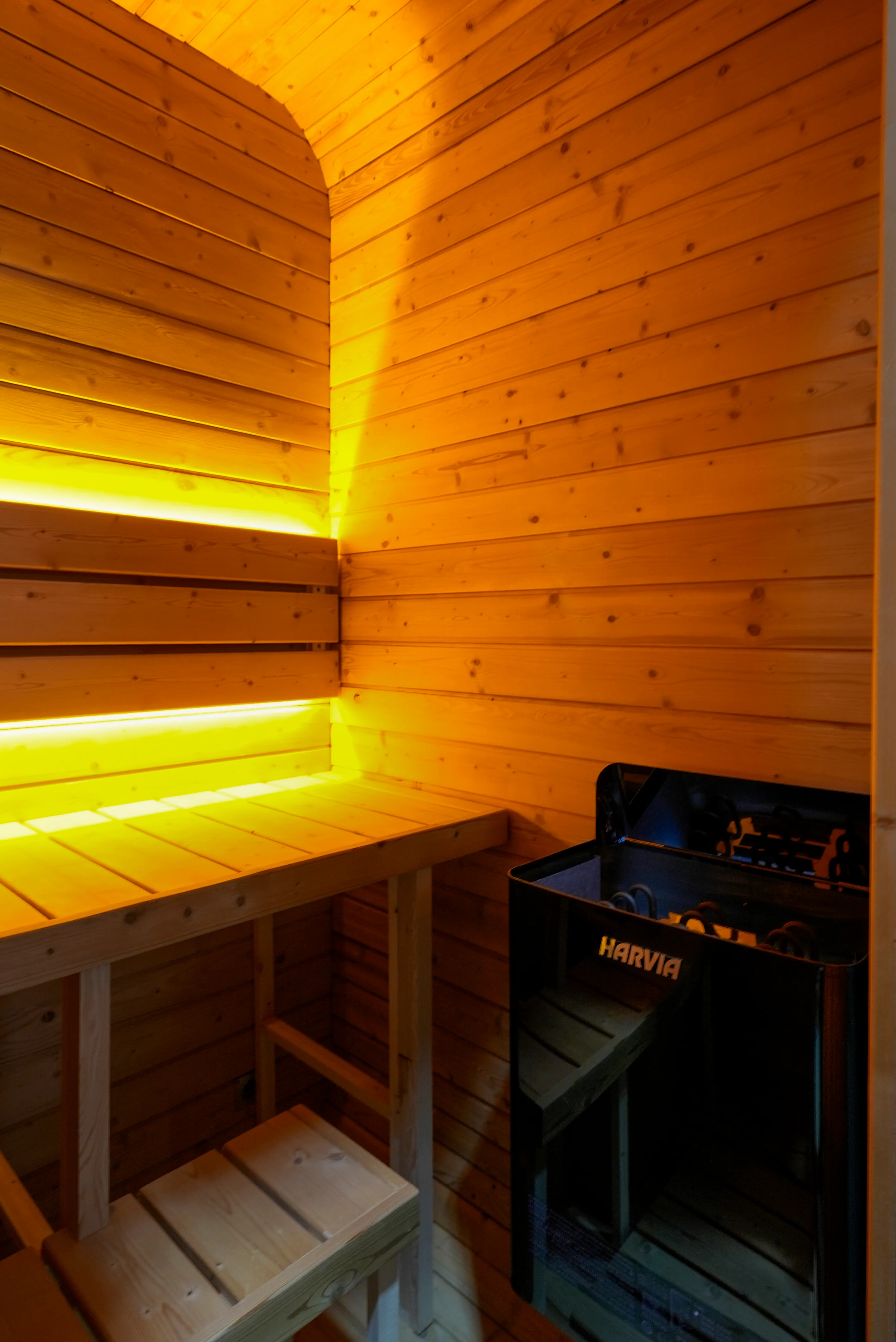 POD 2 interior — two-tier benches, LED strip and Harvia stove